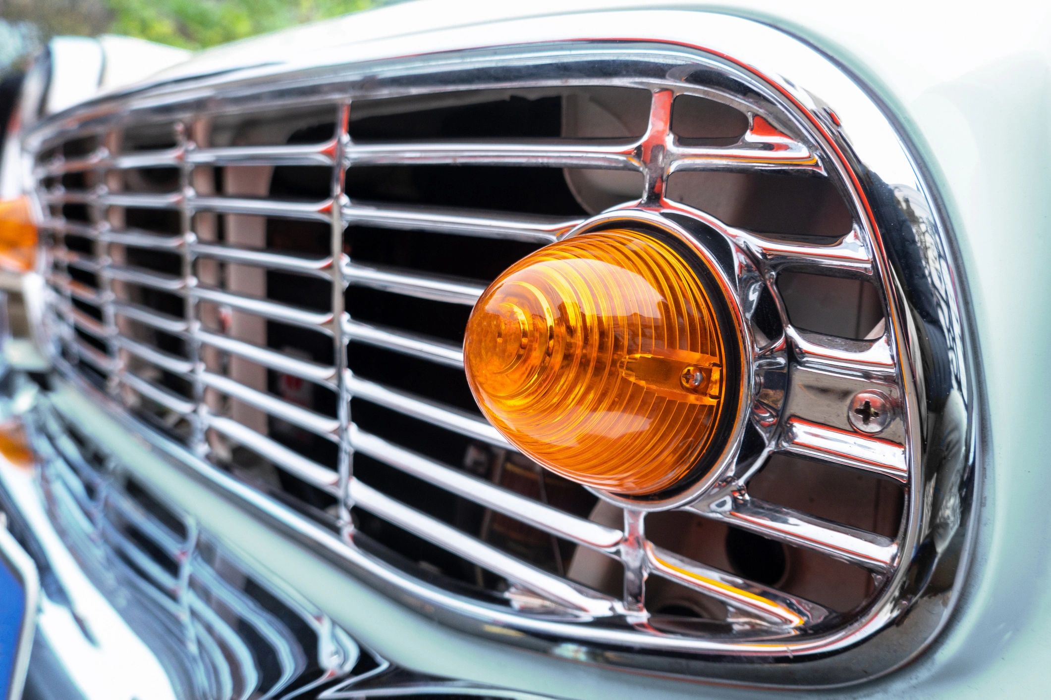 Close-up detail of a polished luxury vehicle grille